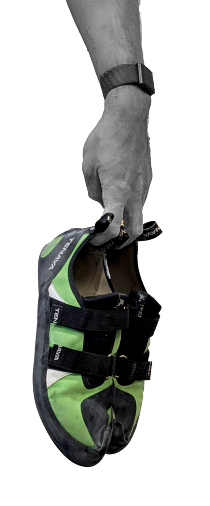 Hand holding a green climbing shoe for Sessions Summer Sendfest 2026.